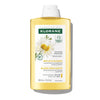 Klorane shampoo bottle with chamomile design on a white background