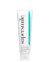 A tube of Supersmile Professional Whitening Toothpaste with the cap on, primarily white in color with green and blue accents on the packaging.