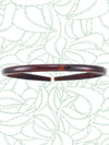 A small tortoise-patterned headband with brown and beige colors, made of durable cellulose acetate.